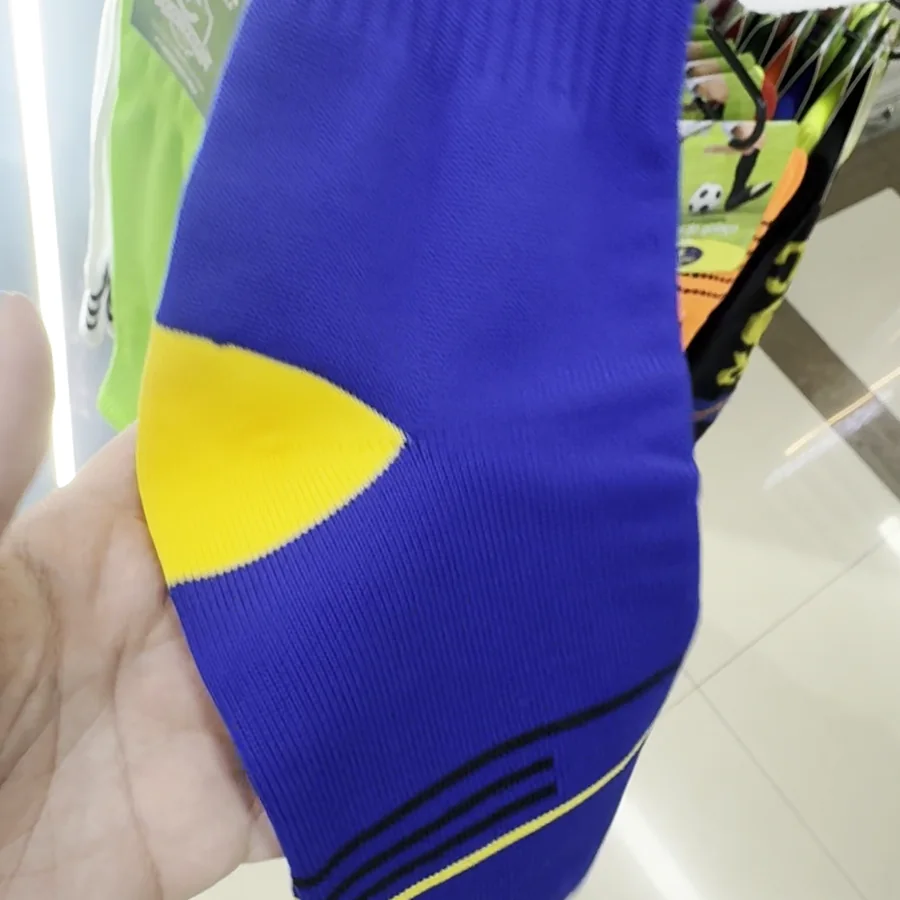 Navy soccer socks, side and sole view